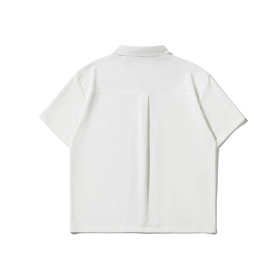 White short-sleeve shirt back view showing collar, back yoke seam and center pleat