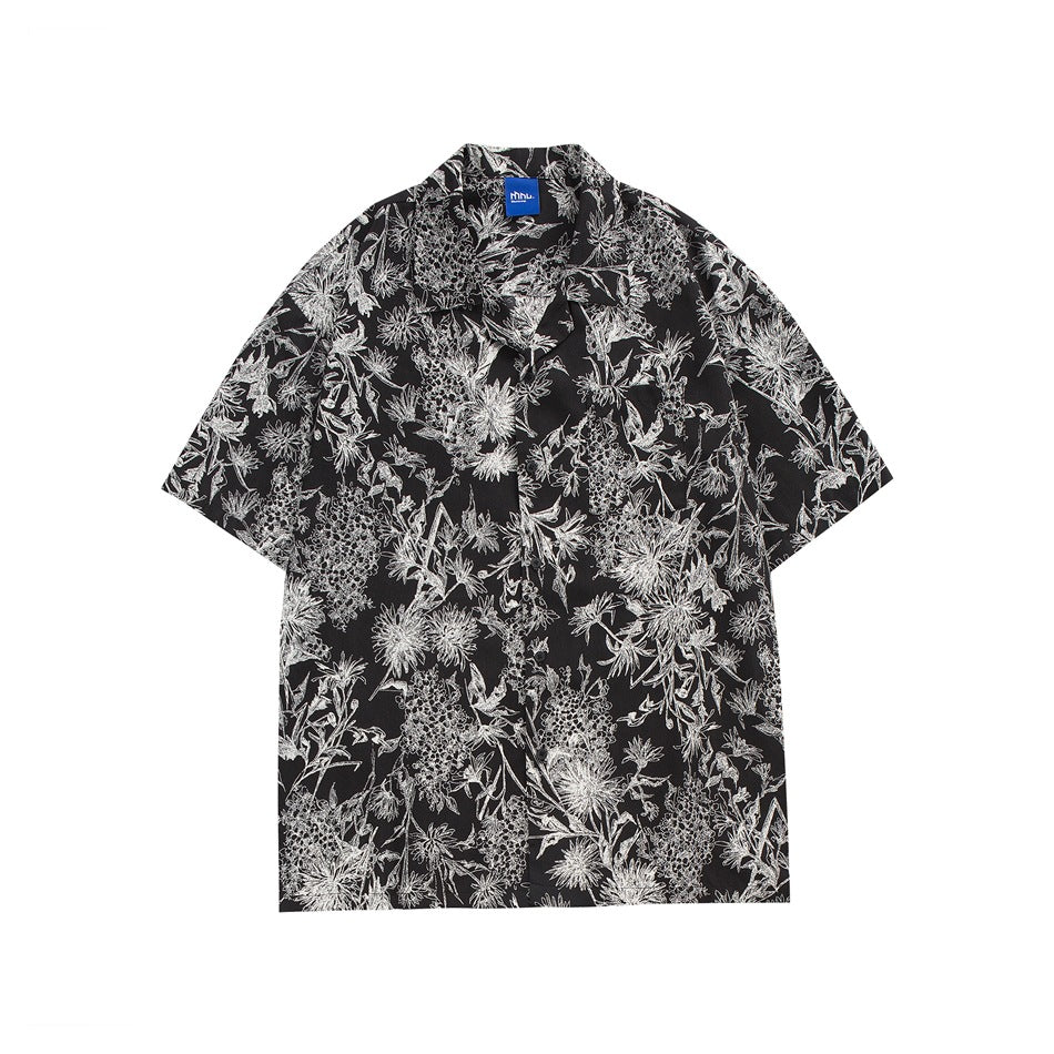 Black short-sleeve camp-collar shirt with an all-over white line-drawn floral print, flat front view