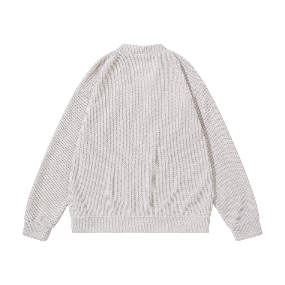 Back view of beige ribbed knit cardigan with dropped shoulders and ribbed cuffs and hem