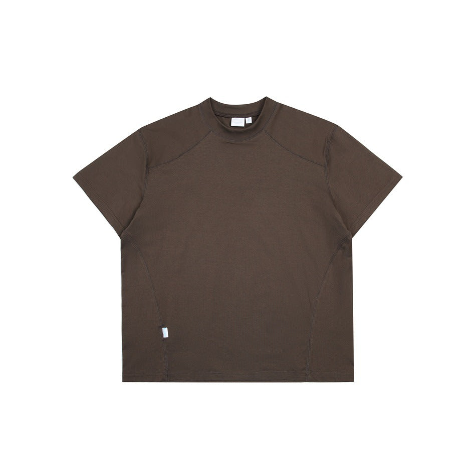 Brown short-sleeve crew-neck T-shirt flat lay with raglan-style shoulder seams and small side label