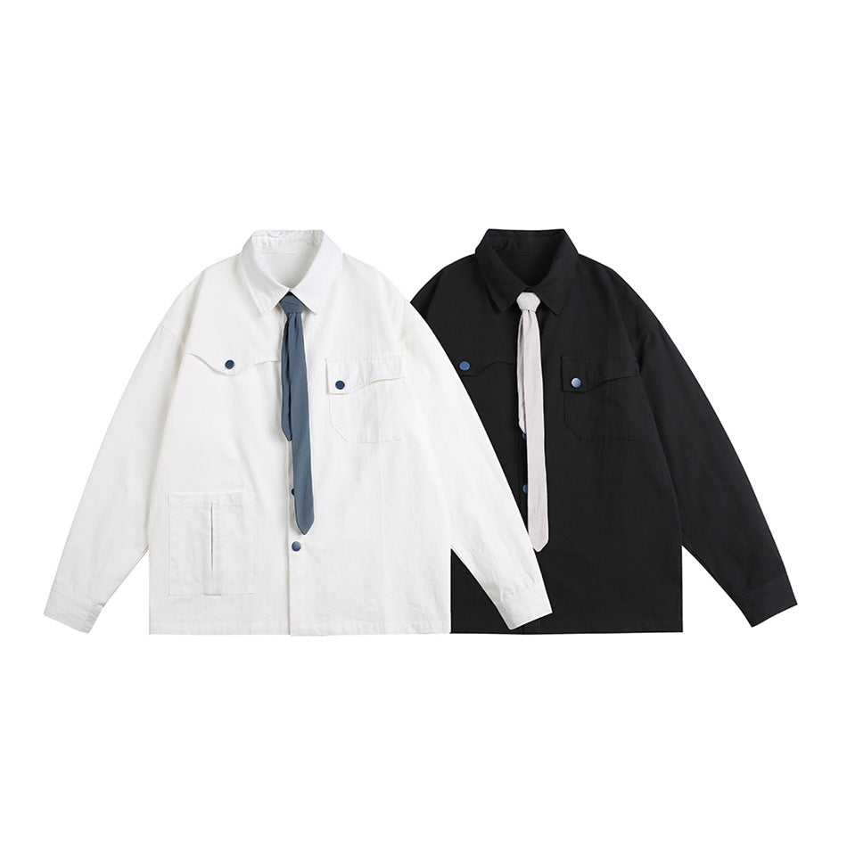 White and black oversized button-front shirts displayed together, each with flap chest pockets and a contrasting tie.