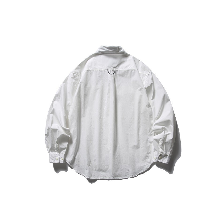 Back view of a white long-sleeve shirt with a yoke seam, center pleat and curved hem.