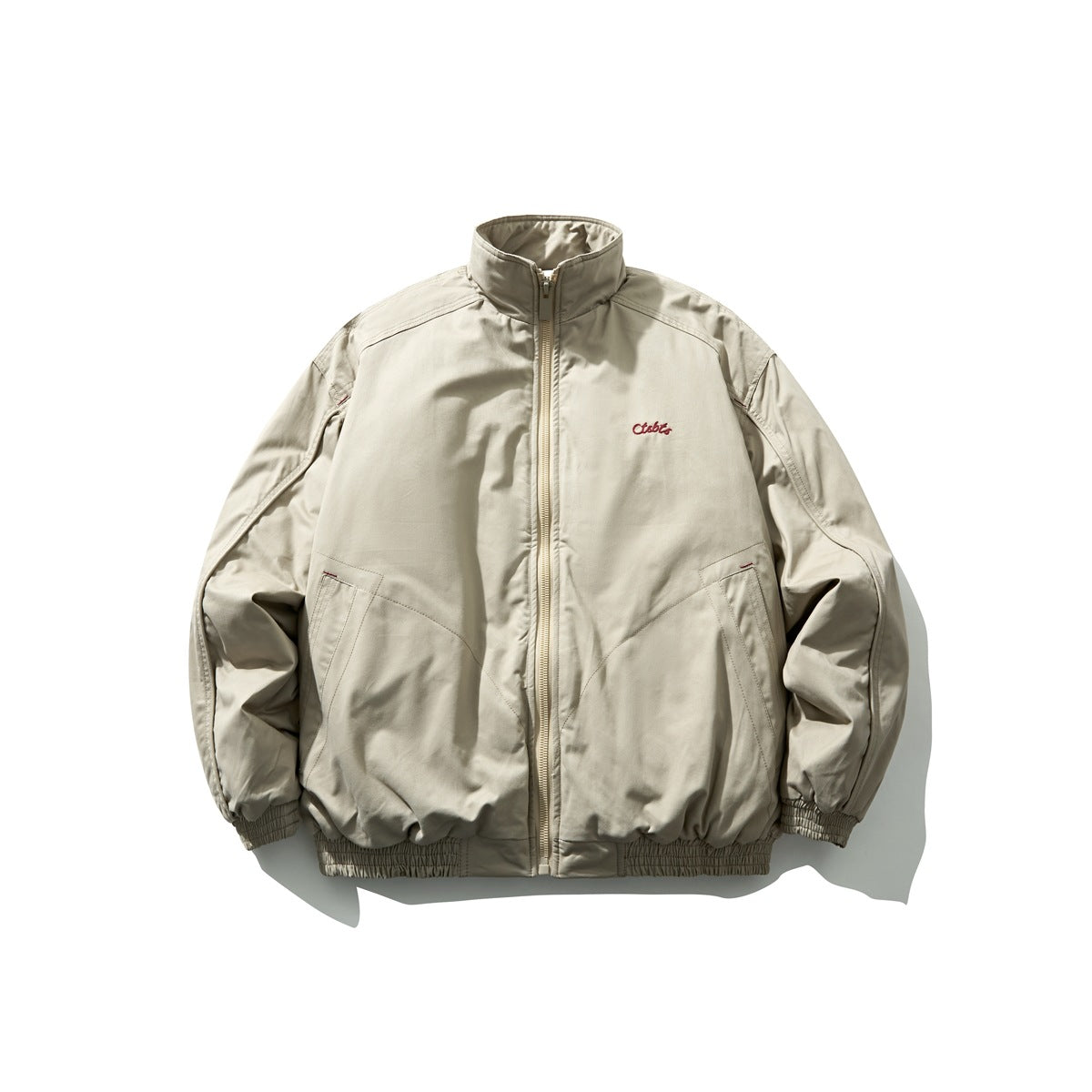 Khaki zip-up stand-collar padded jacket with red script embroidery, slanted pockets and elastic cuffs and hem, flat lay