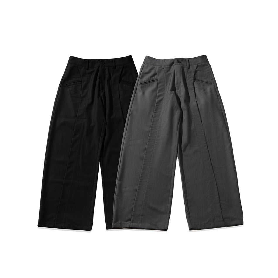 Two pairs of wide-leg trousers shown together: one black and one charcoal gray.