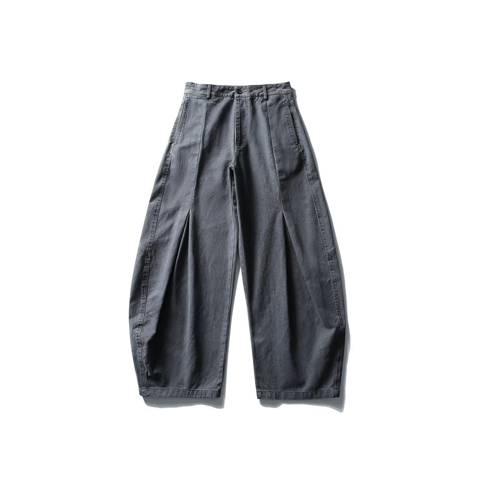 Dark gray wide-leg barrel pants with front pleat seams, button closure and belt loops, flat front view
