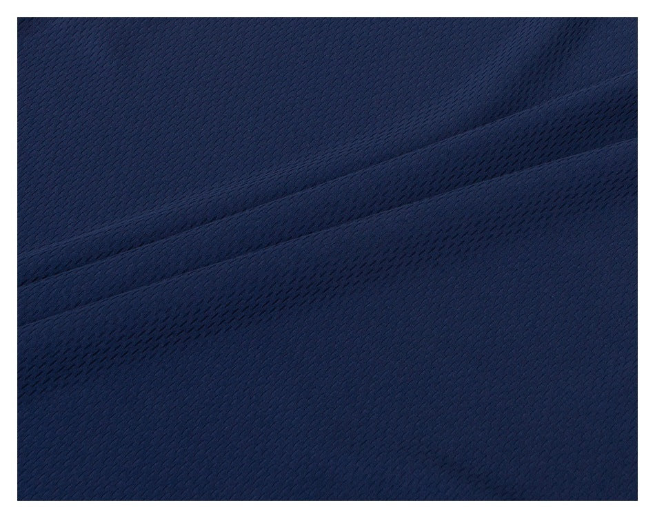 Macro view of the navy fabric's small repeating textured pattern and folds.