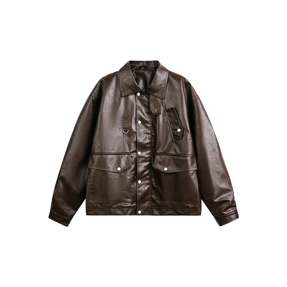 Dark brown faux leather jacket flat lay with collar, snap placket, large flap pockets and button cuffs