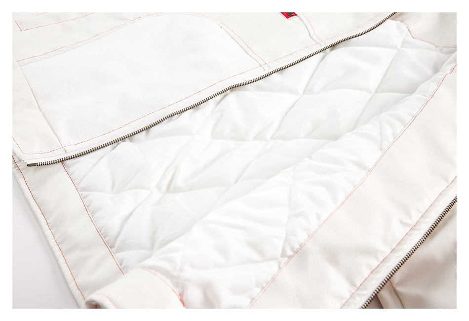 White jacket opened to show its quilted lining, zipper, and red topstitching.