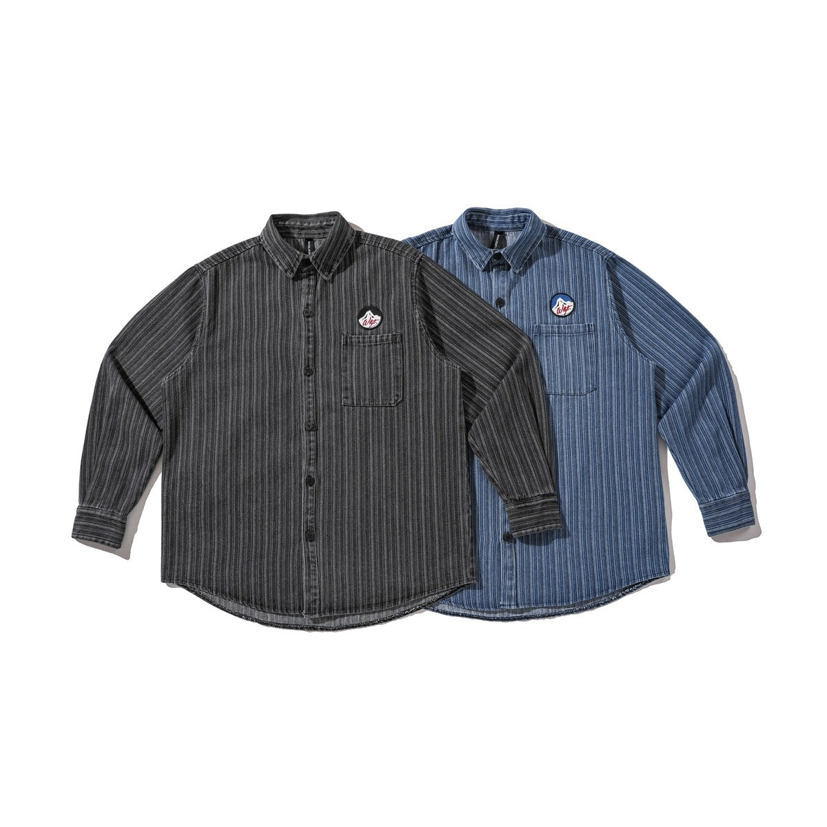 Front view of charcoal and blue long-sleeve pinstriped button-up shirts, each with a chest pocket and embroidered patch.