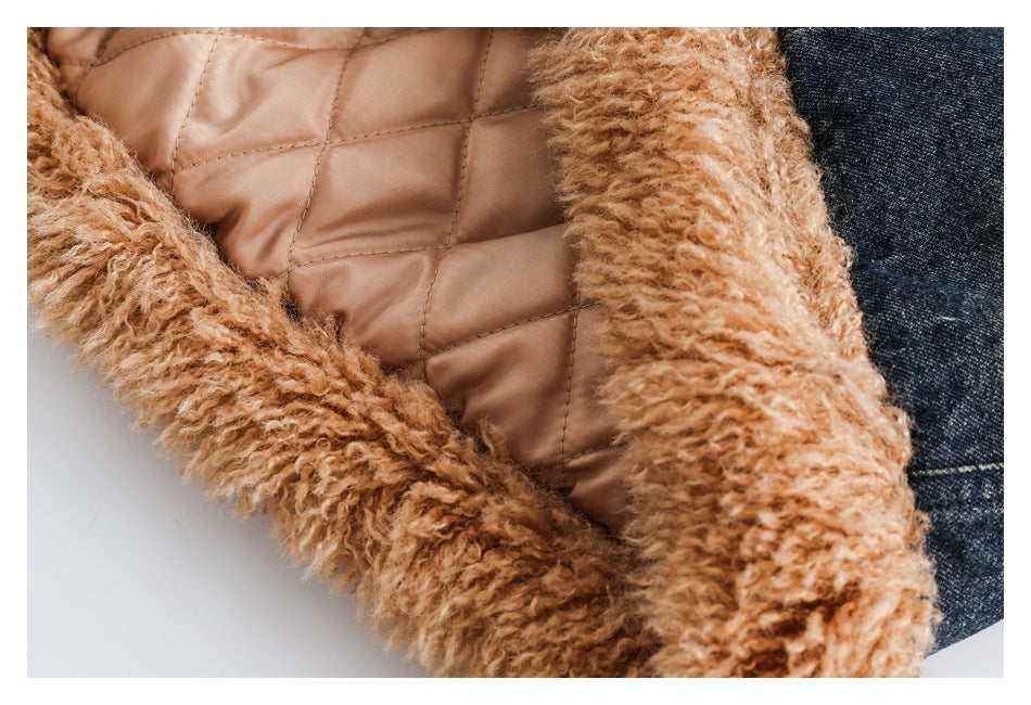 Close-up of tan fuzzy trim and diamond-quilted tan lining inside a dark denim jacket.