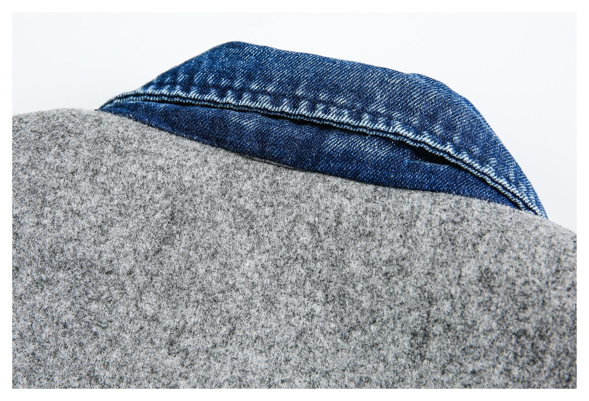 Close-up of the jacket’s blue denim collar layered over gray fabric.