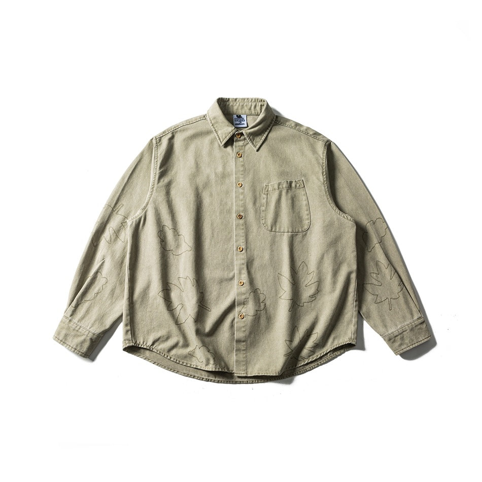 Khaki washed long-sleeve button shirt with chest pocket and outlined leaf embroidery, flat lay front view