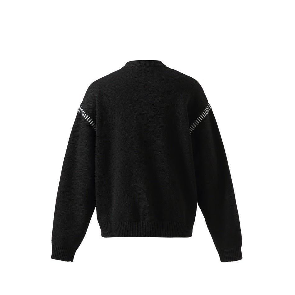 Back view of a black long-sleeve knit sweater with ribbed edges and white stitch accents at the shoulders.