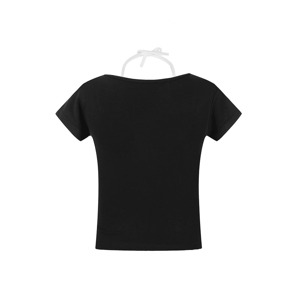 Back view of a plain black short-sleeve T-shirt displayed on a white hanger.