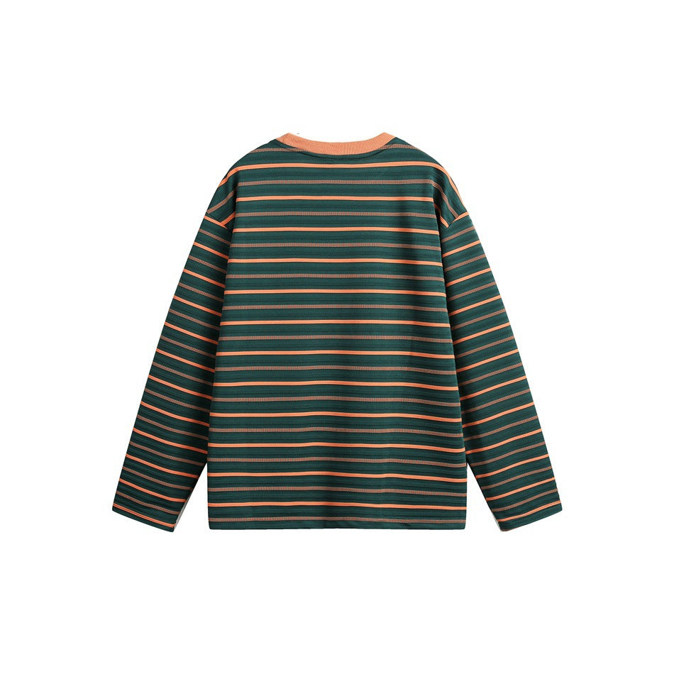 Back view of a dark green long-sleeve top with orange horizontal stripes and an orange neckline.
