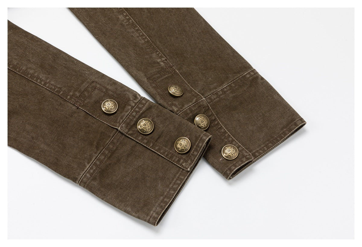 Close-up of brown garment sleeve cuffs with multiple decorative brass-tone buttons.