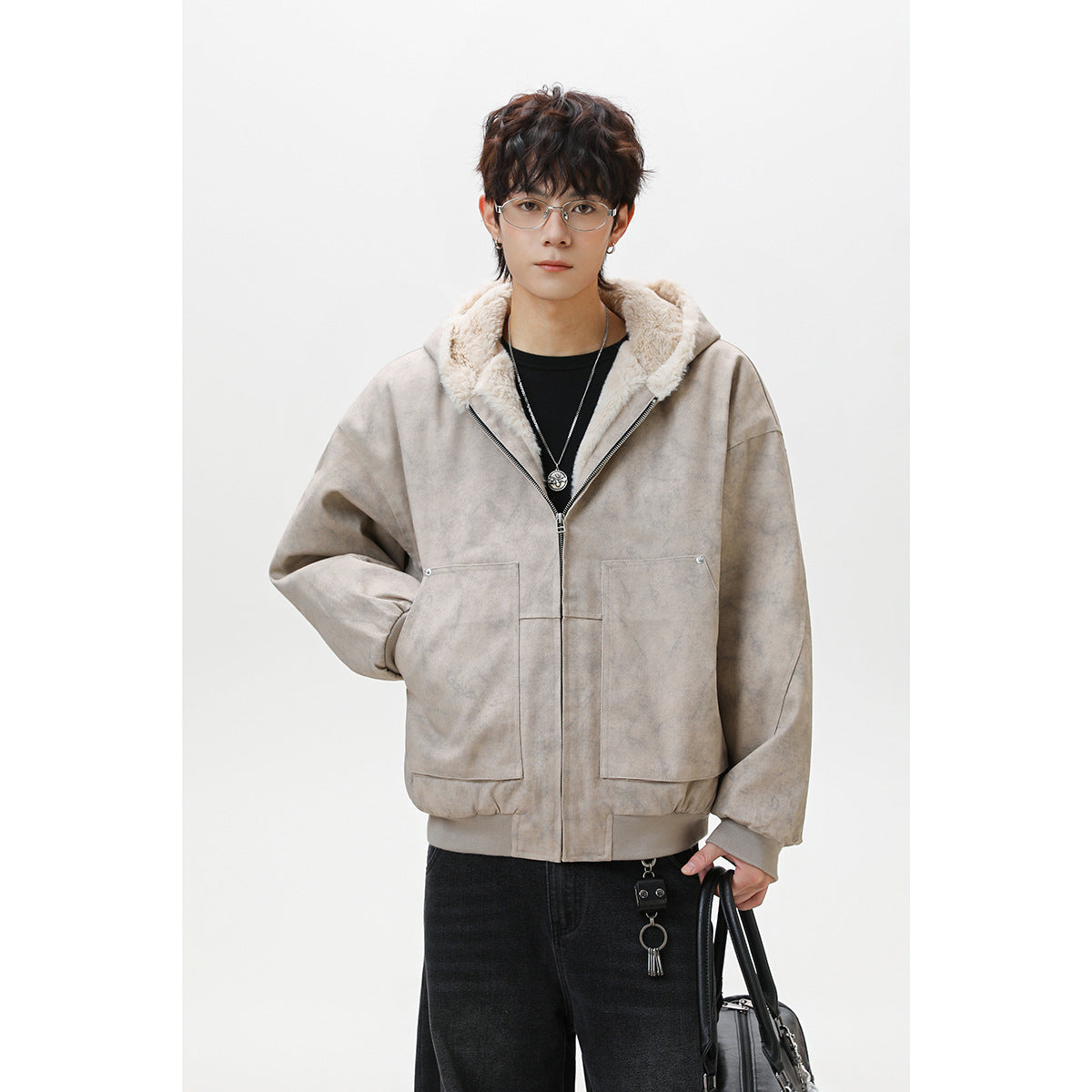 Model wearing a light taupe zip-front hooded jacket with cream plush lining and two large front pockets.