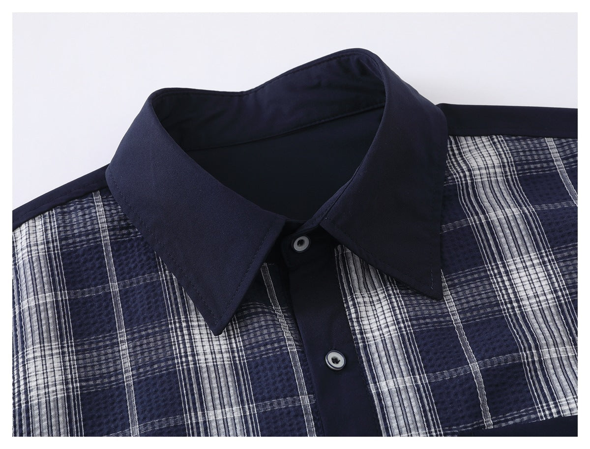 Close-up of a navy shirt collar, button placket, and blue-and-white plaid front.