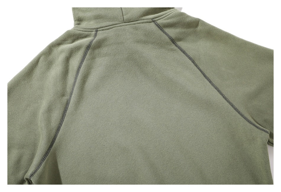 Back view of an olive green hoodie showing its hood and contrast-stitched raglan seams.
