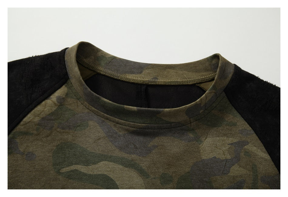 Close-up of the camouflage crew neckline and black raglan shoulder panels.