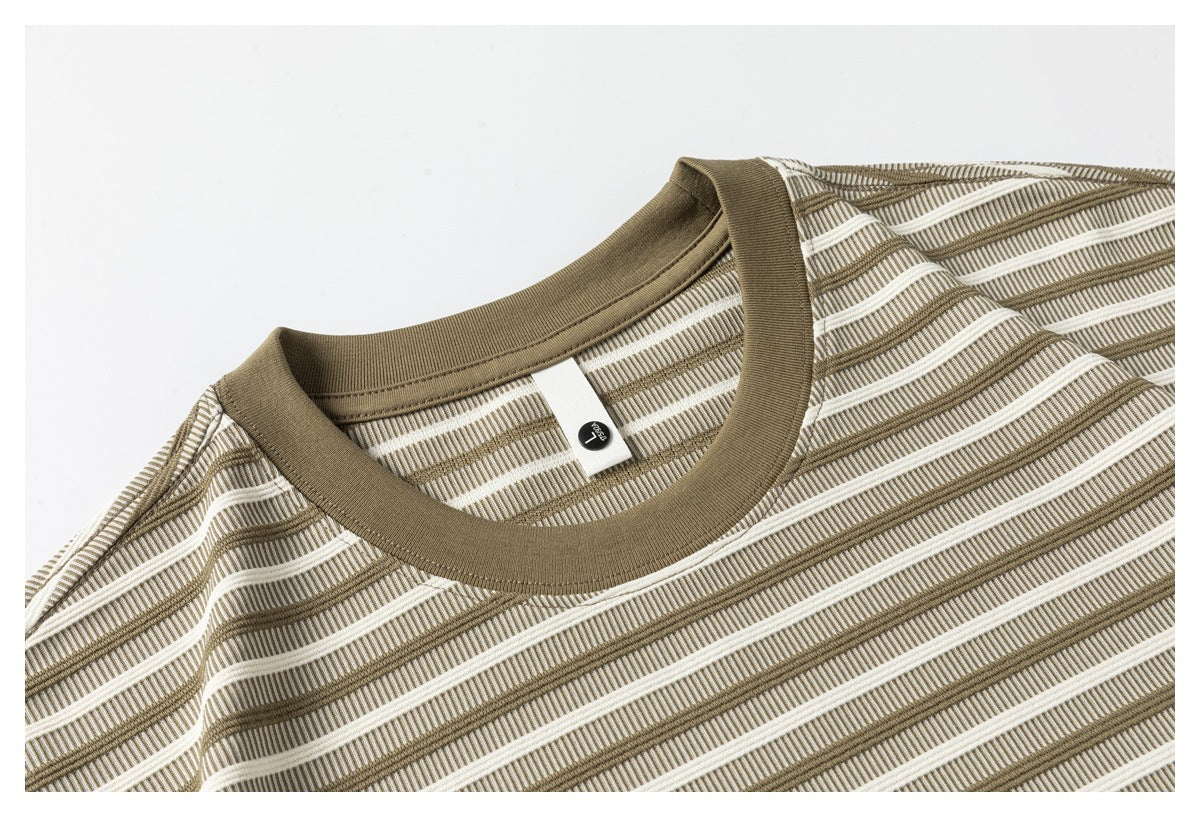 Close-up of a taupe crew-neck collar and cream-and-taupe striped T-shirt fabric.