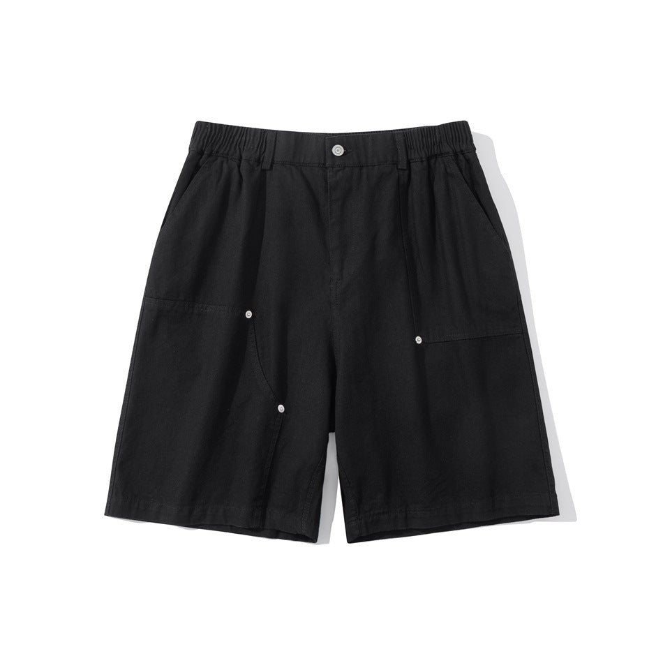 Black knee-length shorts flat lay, front view with elastic waist, button, patch pockets and metal rivets