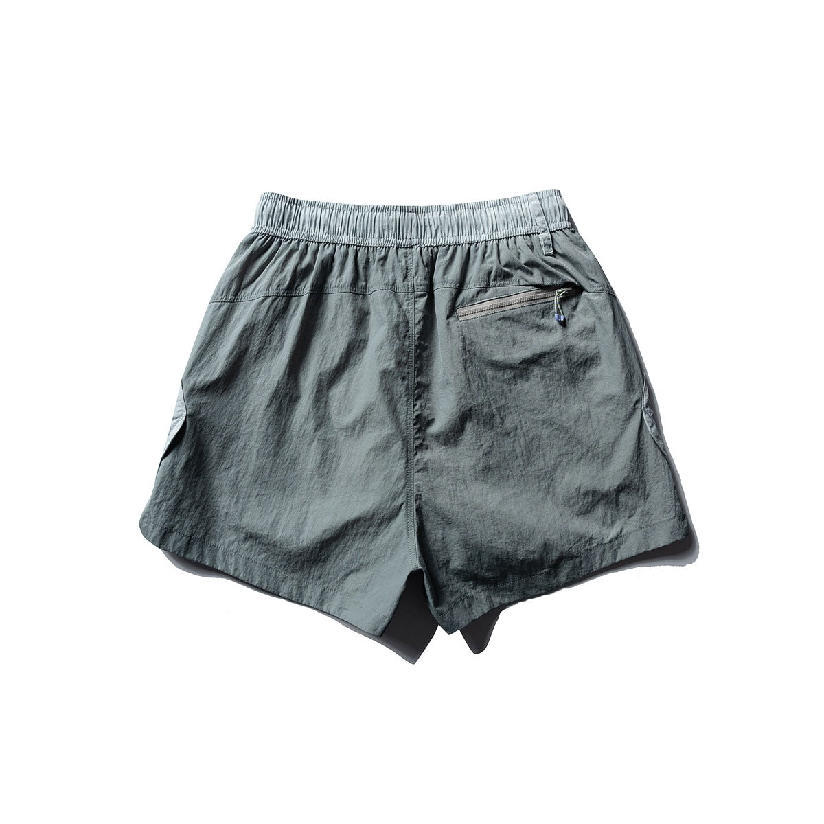 Back view of gray-green shorts with an elastic waistband and a zippered rear pocket.