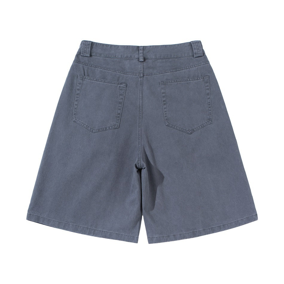 Back view of slate-blue wide-leg shorts with belt loops and two patch pockets.