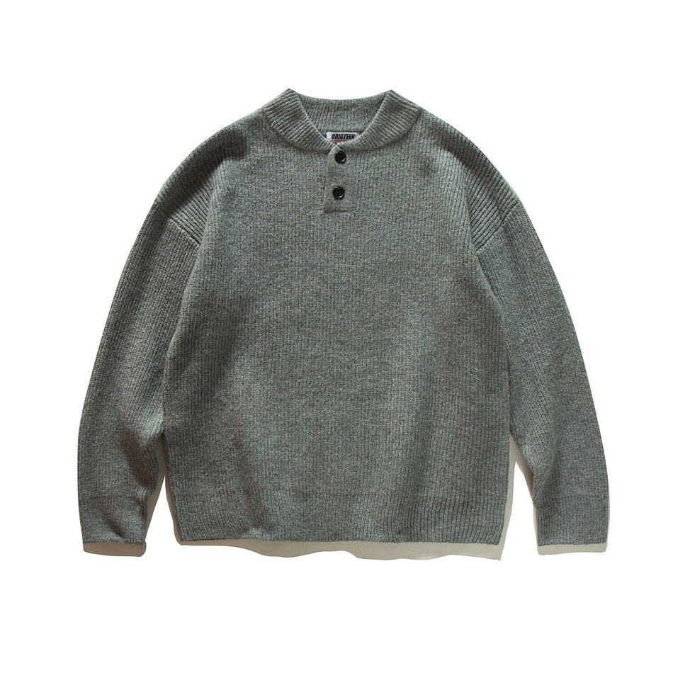 Gray ribbed knit henley-style pullover sweater with two black buttons, flat lay front view