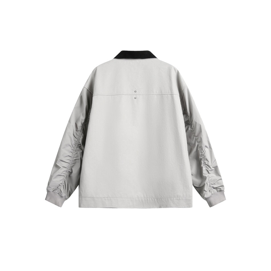Back view of a light gray jacket with a black collar, gathered sleeves, and ribbed cuffs.