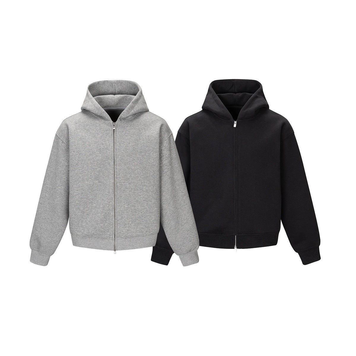 Front view of two plain zip-up hoodies, one heather gray and one black, with hoods and ribbed cuffs.