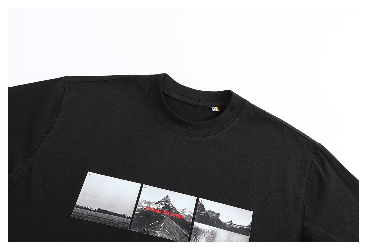 Cropped front view of a black crew-neck T-shirt with a three-panel monochrome landscape graphic and red text.