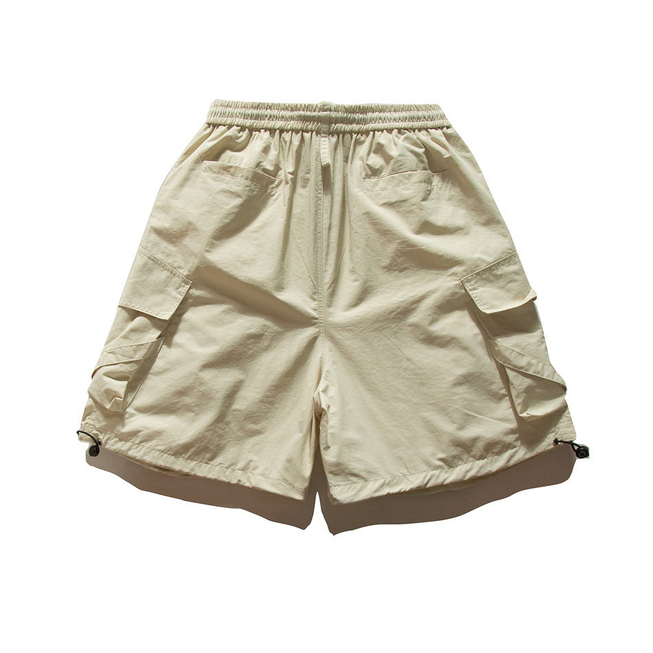 Beige cargo shorts back view showing flap back pockets, side cargo pockets and hem drawcords