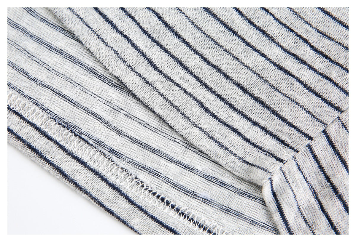 Close-up of the striped shirt's inside hem with overlock stitching.