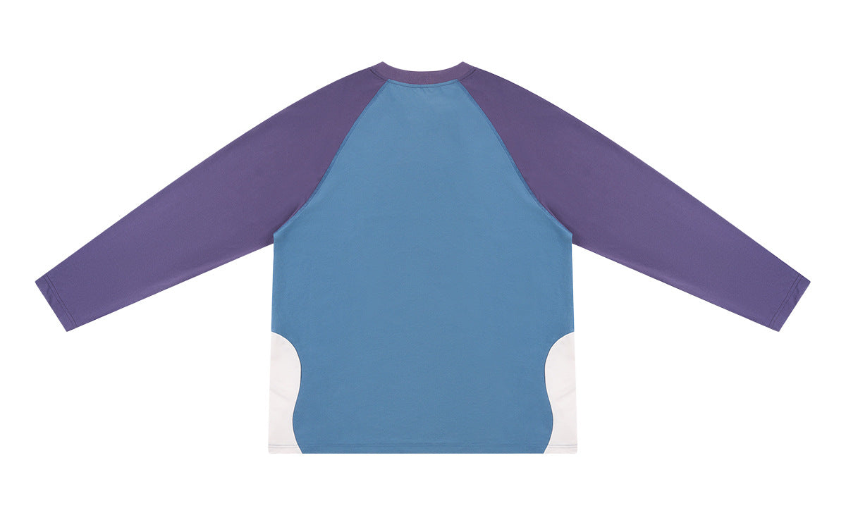Flat-lay back of a color-block long-sleeve shirt with a blue body, purple sleeves, and white lower side panels.