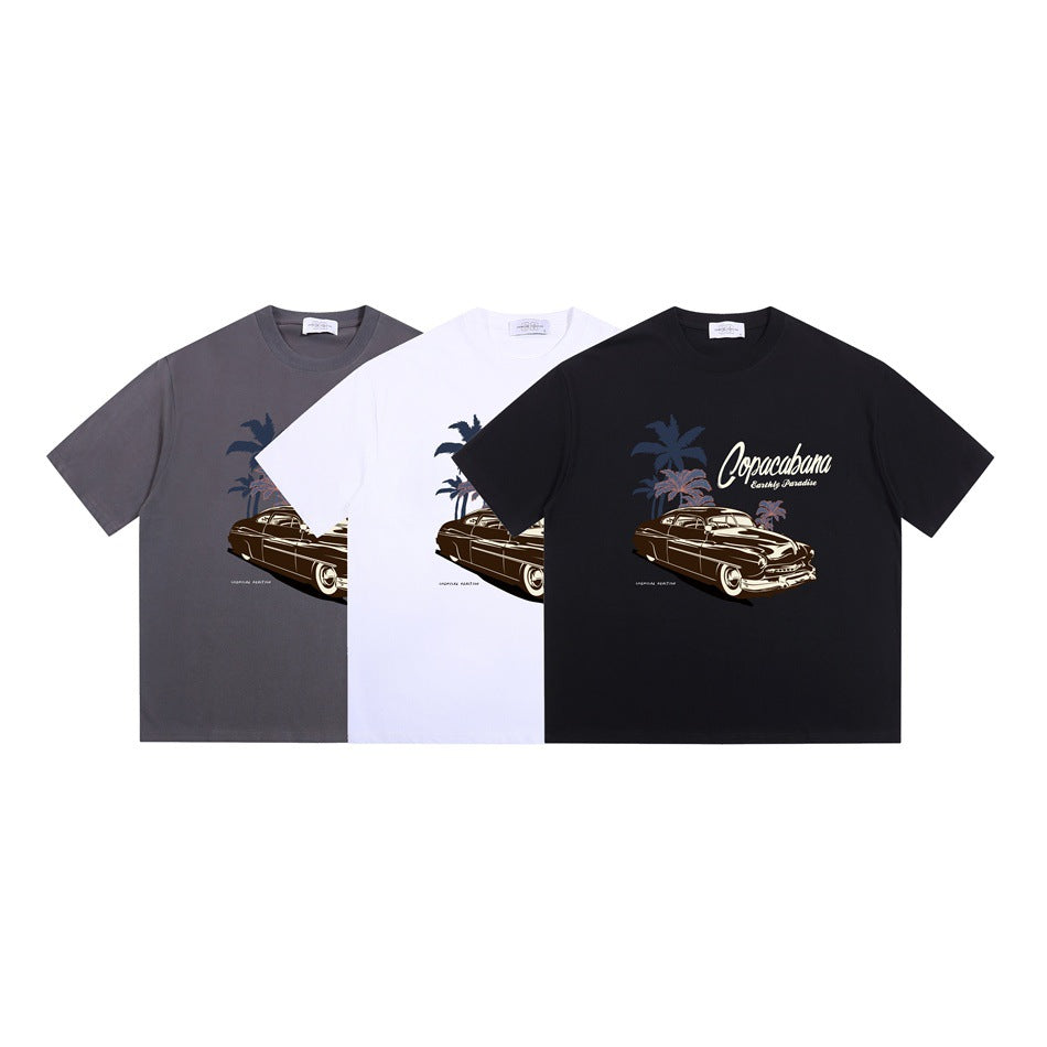 Three crew-neck graphic T-shirts in gray, white, and black, each printed with a classic car and palm trees.