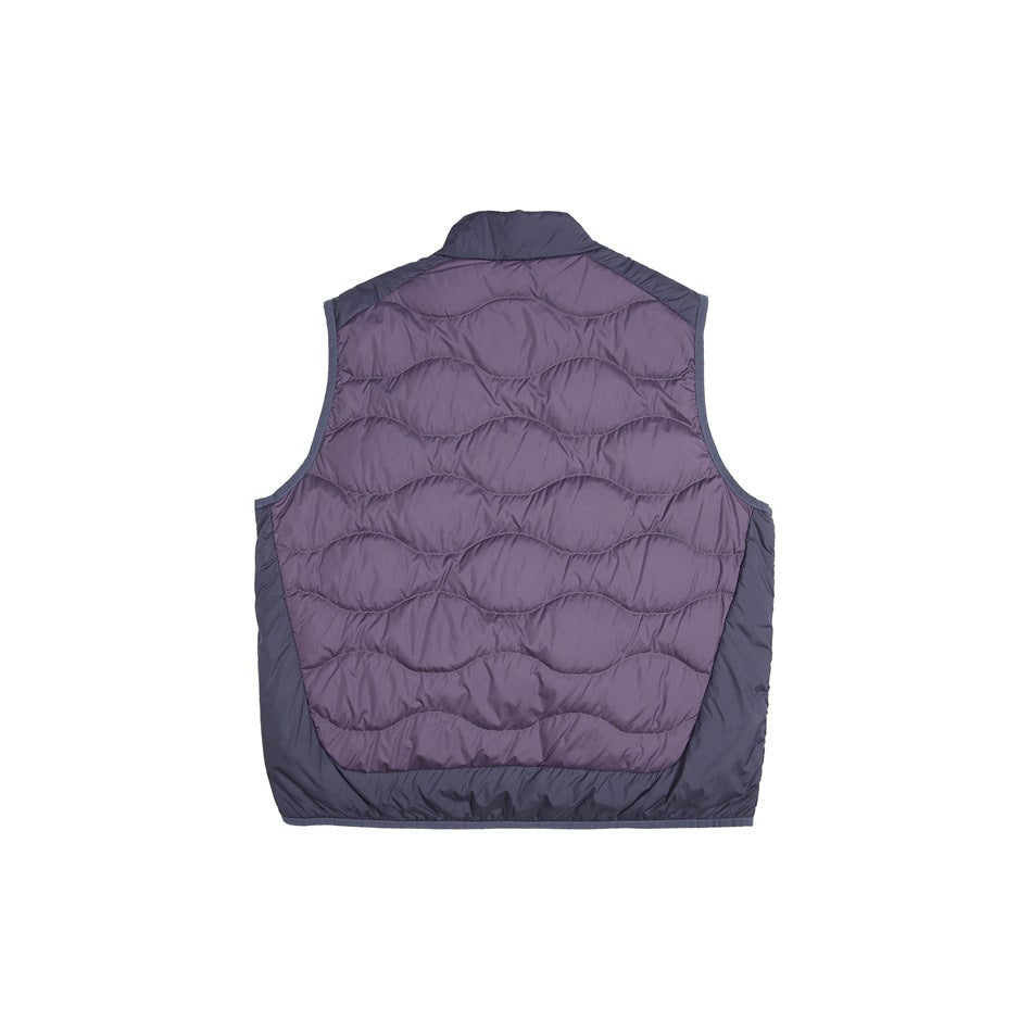 Back of a sleeveless quilted vest with a muted purple wavy-stitched panel and dark gray-purple sides and trim.