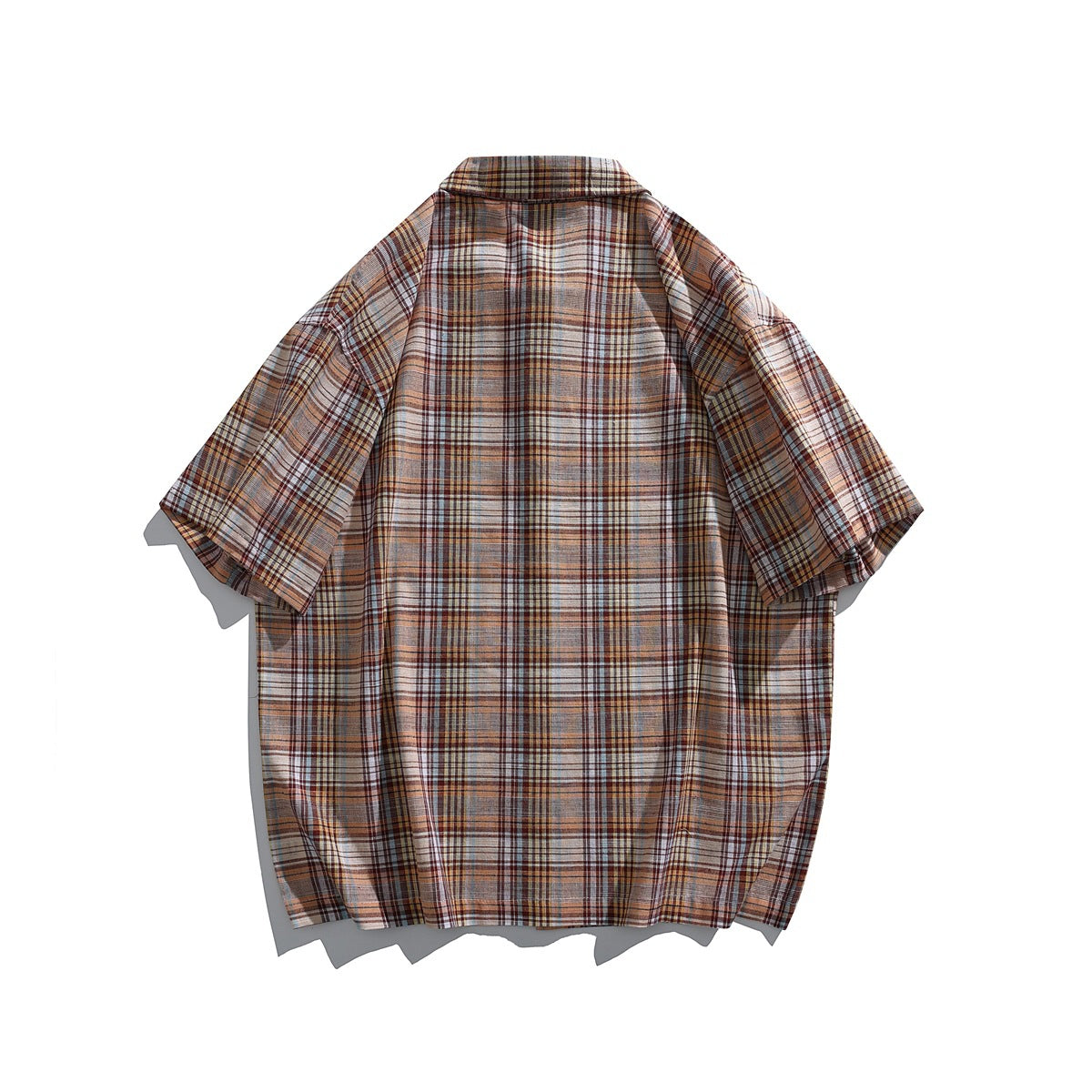 Back view of a short-sleeve button-up shirt in rust, tan, cream and blue plaid.