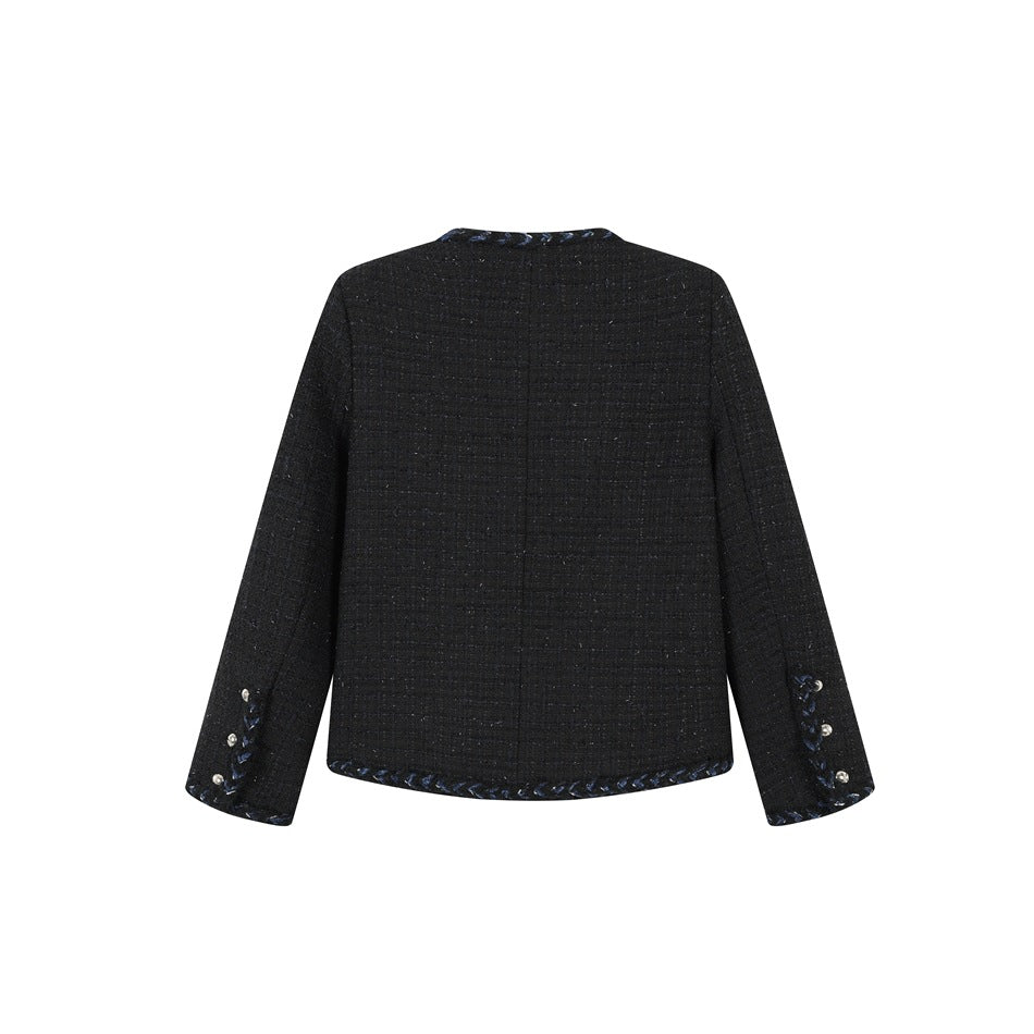 Back view of black tweed-look jacket with center seam, braided hem trim and pearl-like buttons on the cuffs