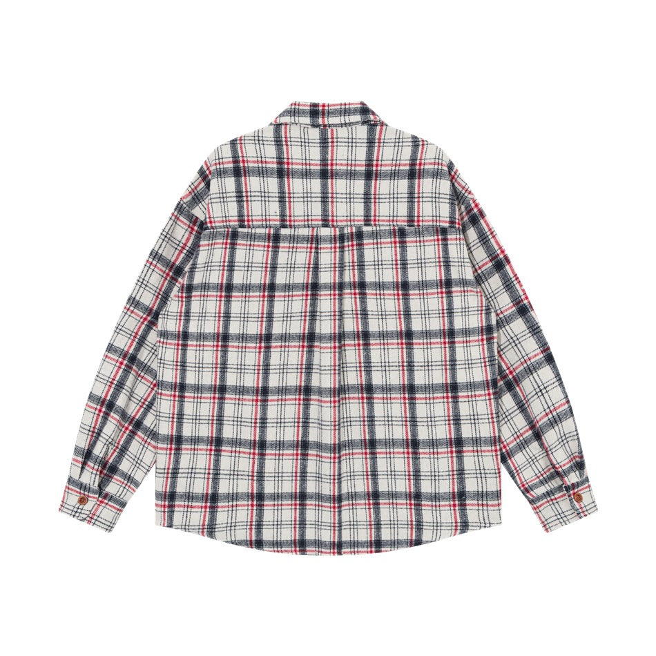 Back view of white plaid shirt with navy and red checks, back yoke seam, center pleat and button cuffs, flat lay