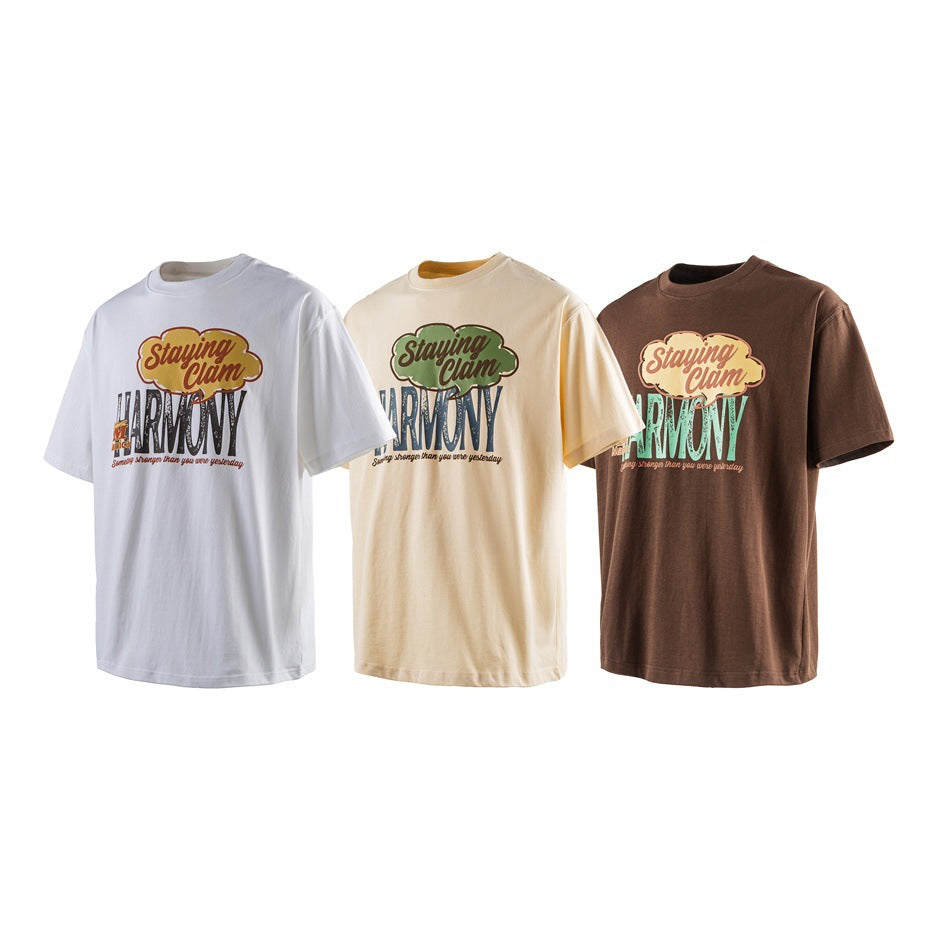 Three short-sleeve graphic T-shirts in white, pale yellow, and brown, shown from the front.
