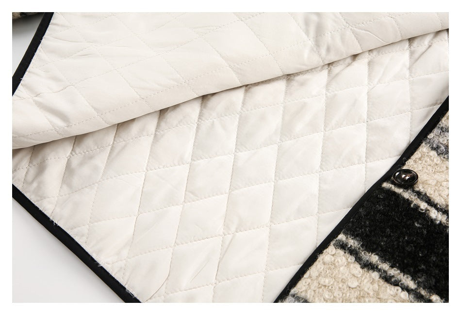 Close-up of cream diamond-quilted lining with black binding, beside a black-and-cream textured exterior and button.