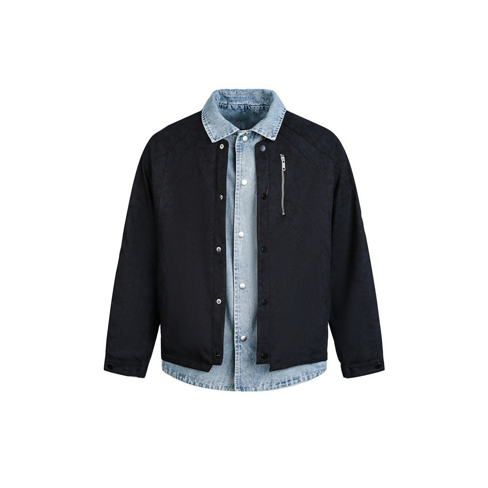 Black snap-front jacket with a light blue denim-look collar and layered placket, flat front view