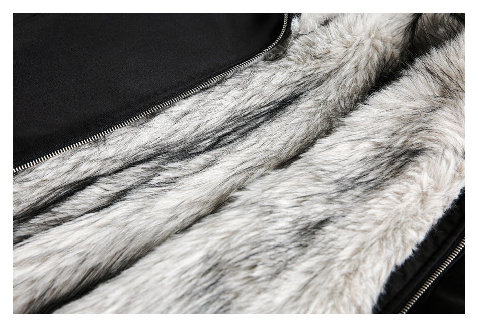 Close-up of a black jacket unzipped to show a thick white-and-gray faux-fur lining.