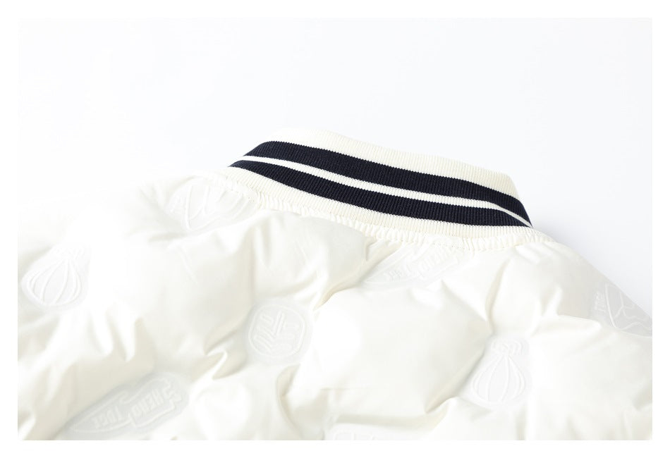 Close-up of a white garment collar with navy stripes and repeating raised emblems across the fabric.