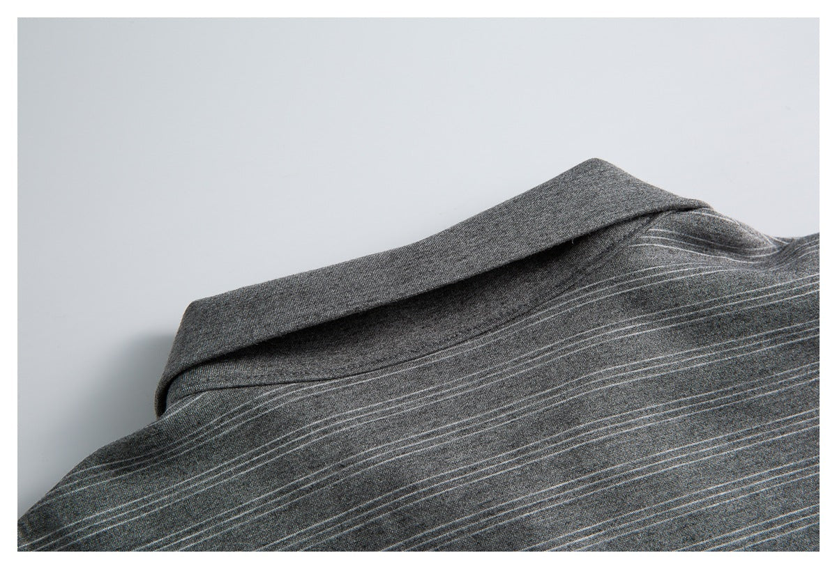 Close-up of the charcoal gray shirt collar and fine light stripe pattern.