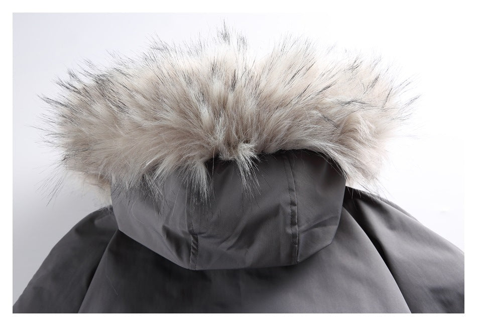 Rear close-up of a dark gray jacket hood edged with thick pale gray fur trim.