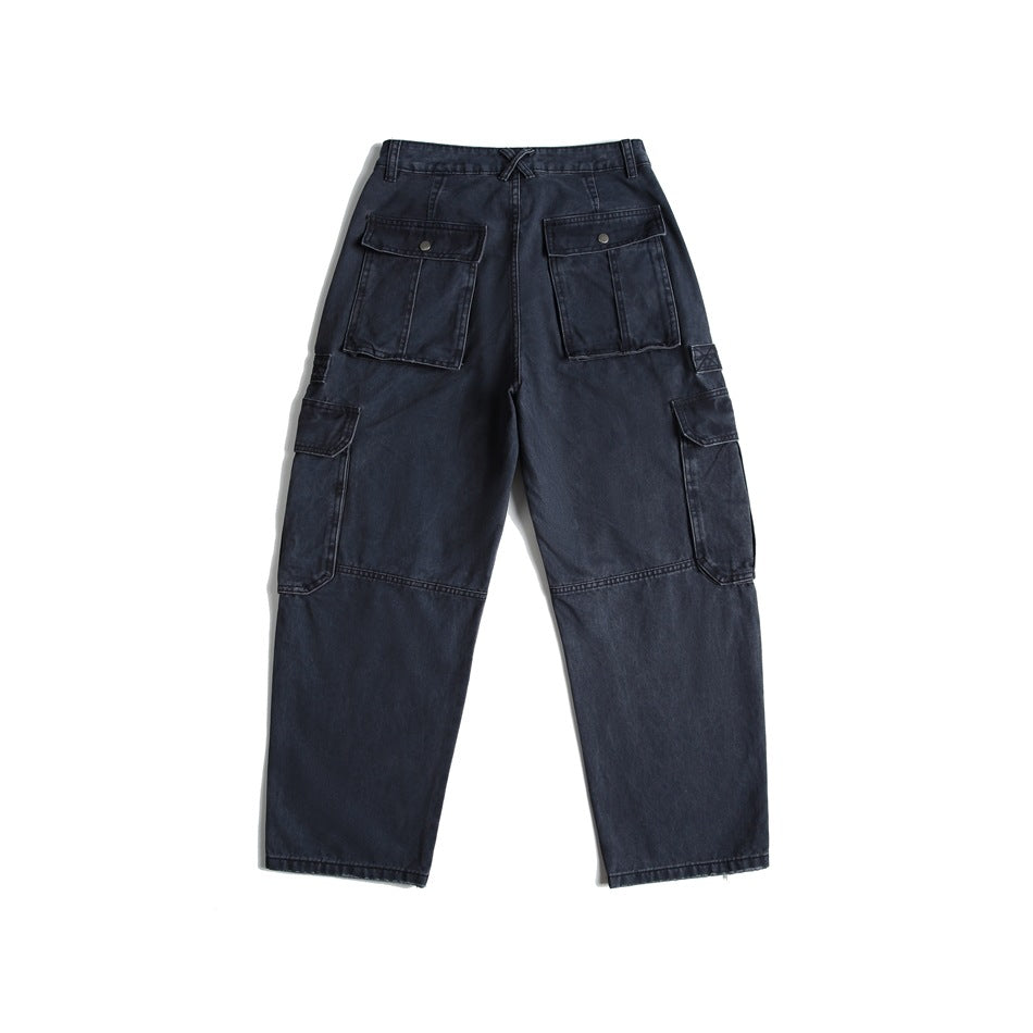 Back view of dark navy cargo pants with two buttoned rear pockets and large side cargo pockets.