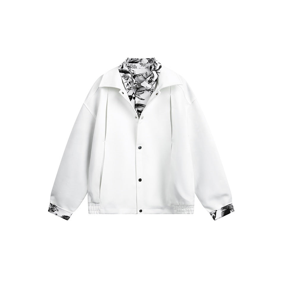 White jacket flat lay with black-and-white print collar and cuffs, snap-button front and elastic hem