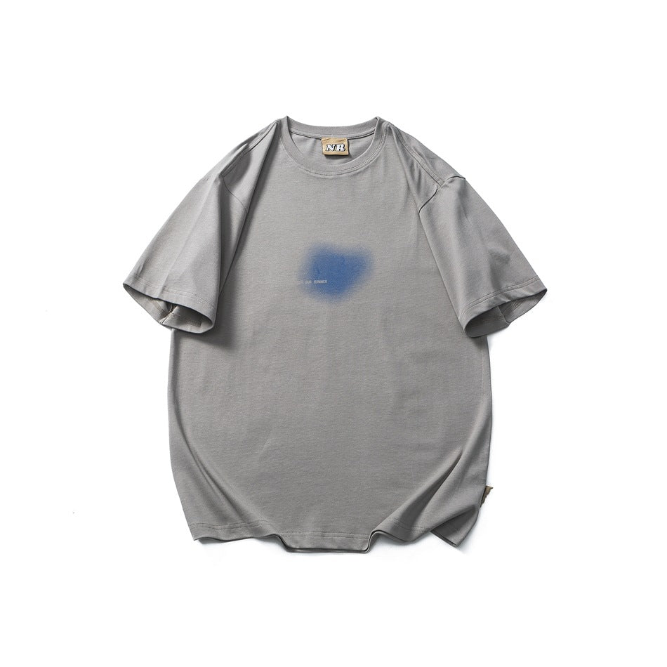 Gray short-sleeve crew neck T-shirt flat lay with a blurred blue graphic on the front chest